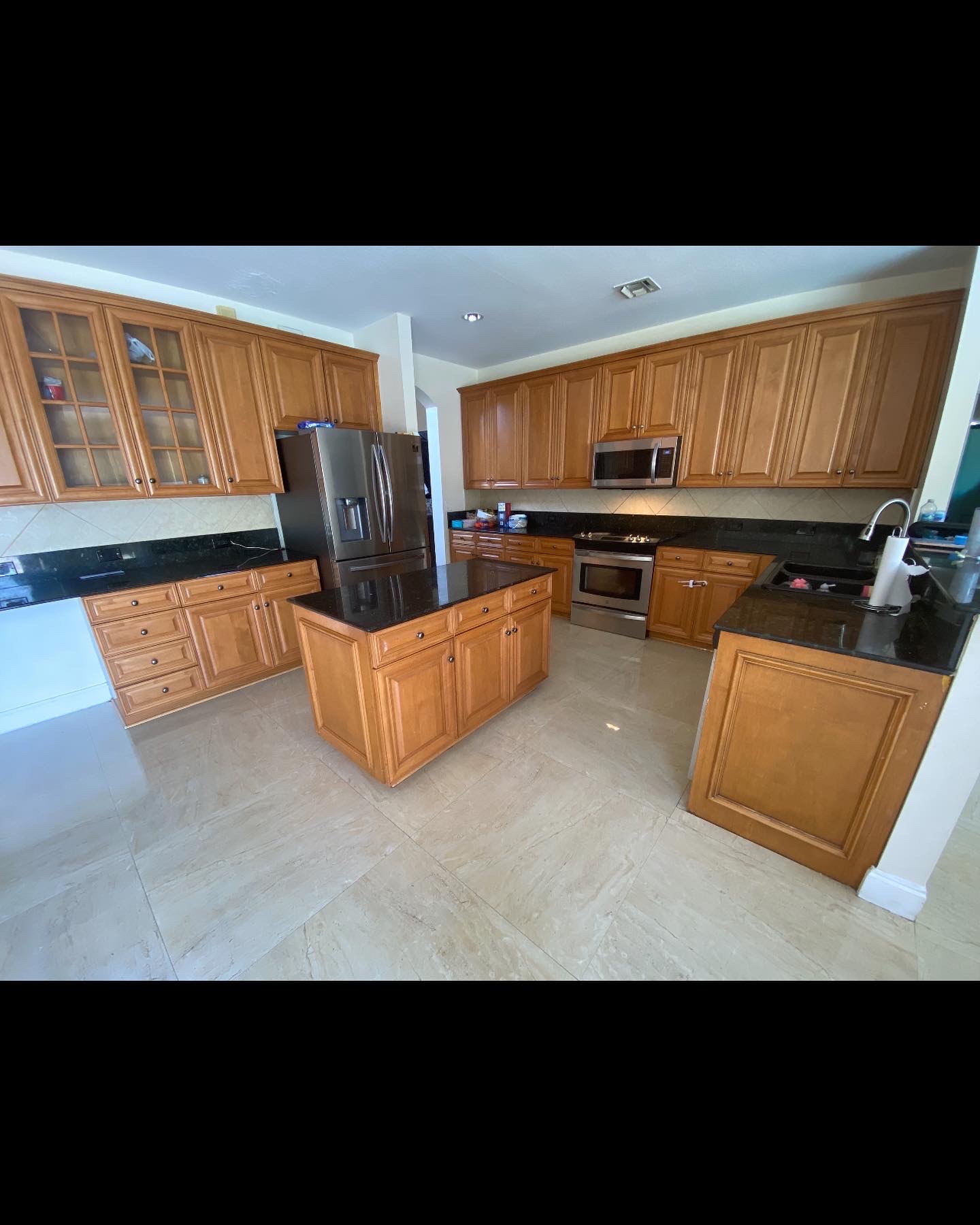 Kitchen before the cabinets were painted