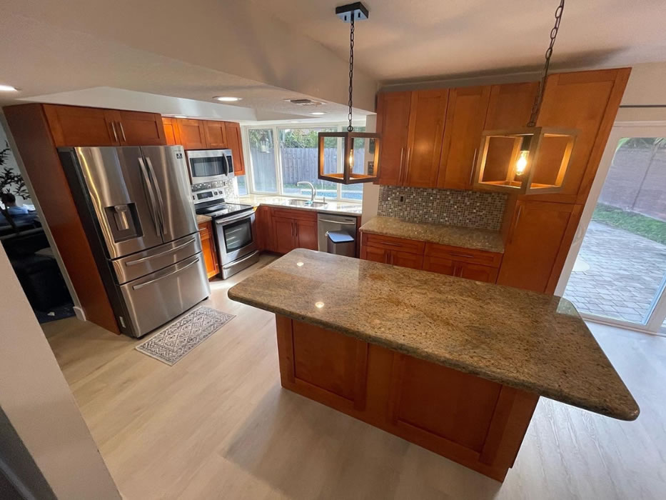 Dated wood kitchen cabinets before refinishing