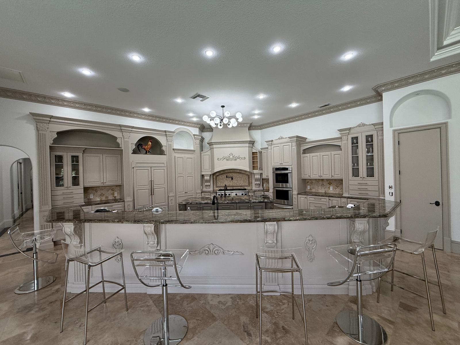 Repainted kitchen cabinetry with a sprayed finish