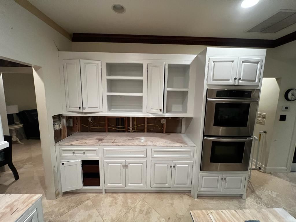 Refinished cabinets and hardware after painting