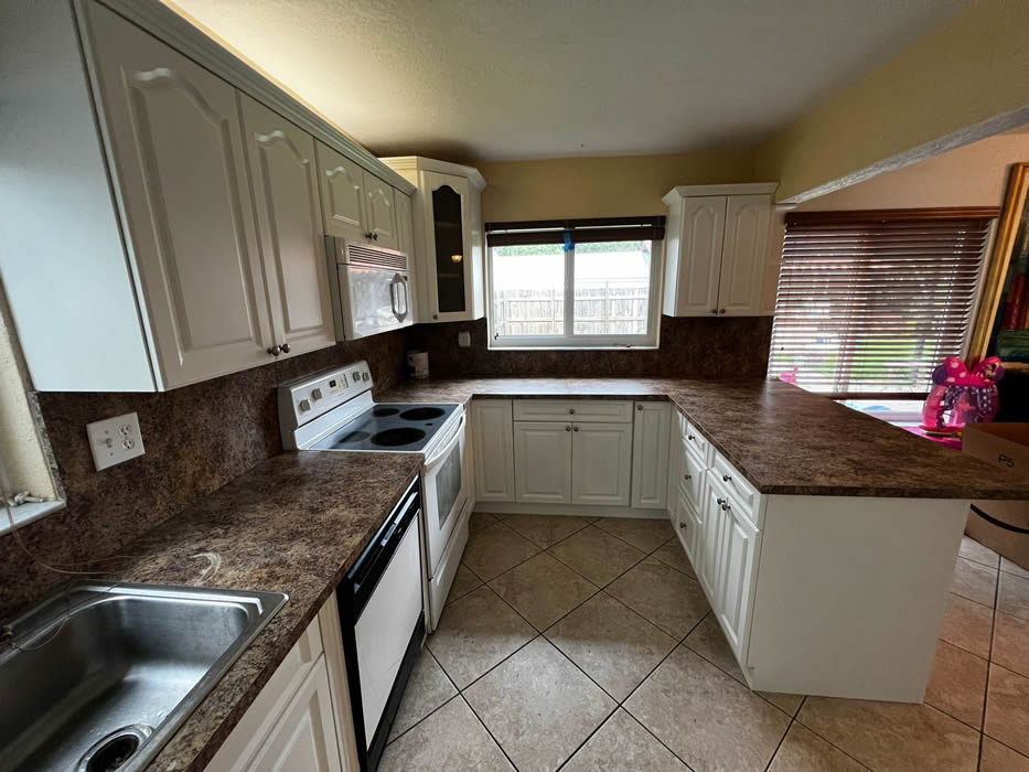 Kitchen cabinets after being painted by CKME The Brothers
